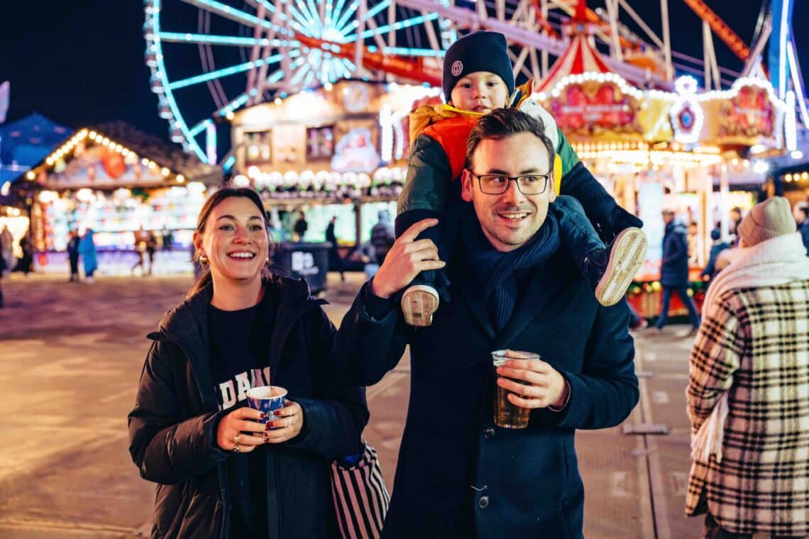 Family walking through Hyde Park Winter Wonderland